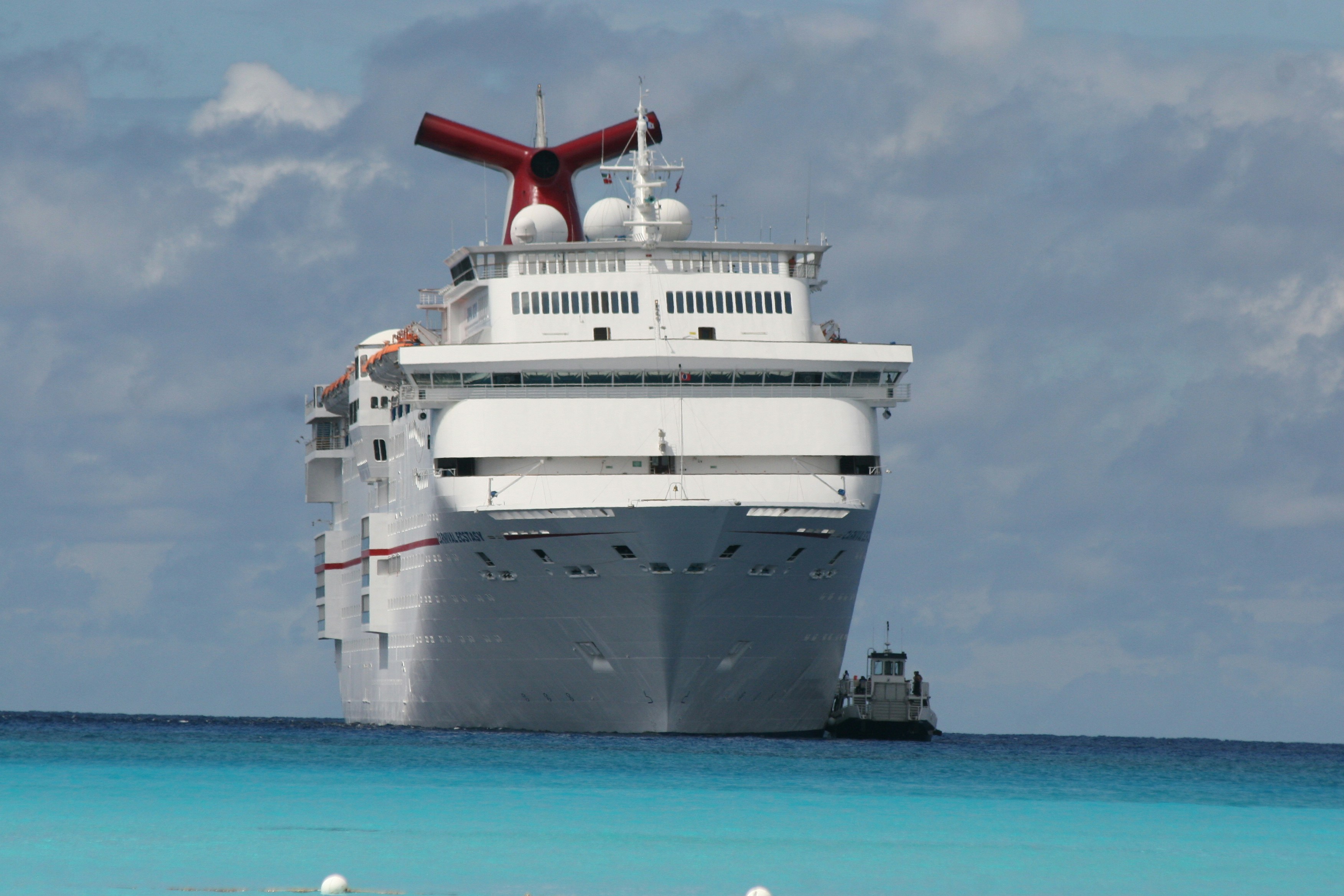 white ship on sea under blue sky during daytime, carnival cruise, half moon cay, vacation