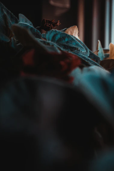 A close-up shot of a textured fabric with vibrant colors blending softly under natural light.