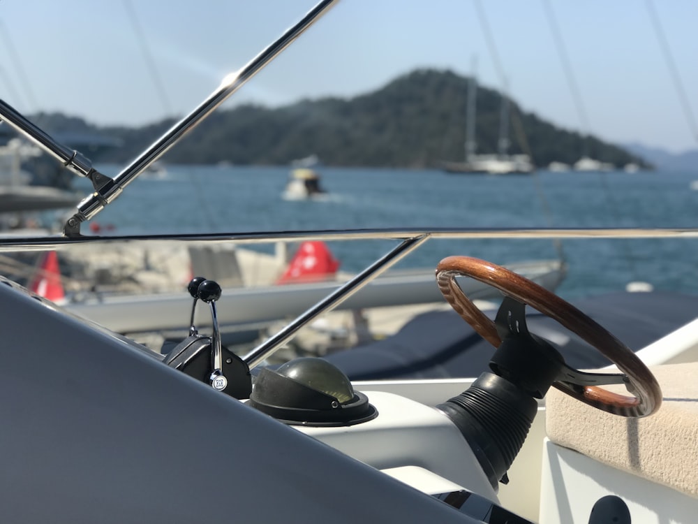 white and black boat on sea during daytime