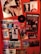 A vibrant collage of music posters and promotional materials is displayed on a red wall. The collection features various artists and bands, with images and text highlighting events and albums. In the mix, there are colorful and black-and-white posters, including an image of someone holding a trophy and a vinyl record affixed to the wall. The aesthetic is lively and energetic, with a focus on musical culture.