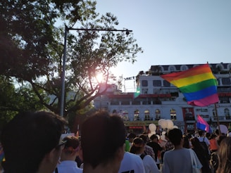 A vibrant group of diverse people enjoying an outdoor gathering, symbolizing freedom and community spirit.