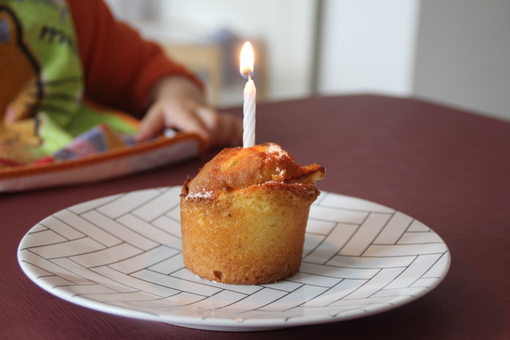 brown cupcake on white paper plate