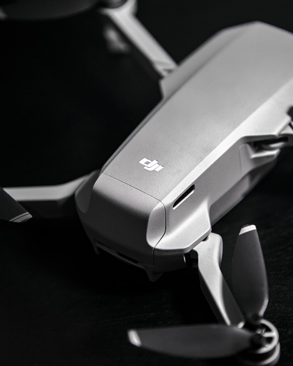 gray and white stapler on black wooden table