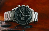 silver and black round analog watch