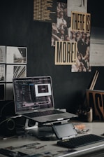 black and gray laptop computer on brown wooden table