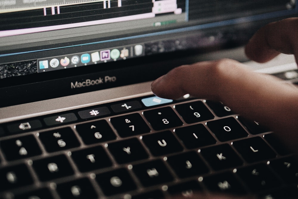 black and silver macbook pro