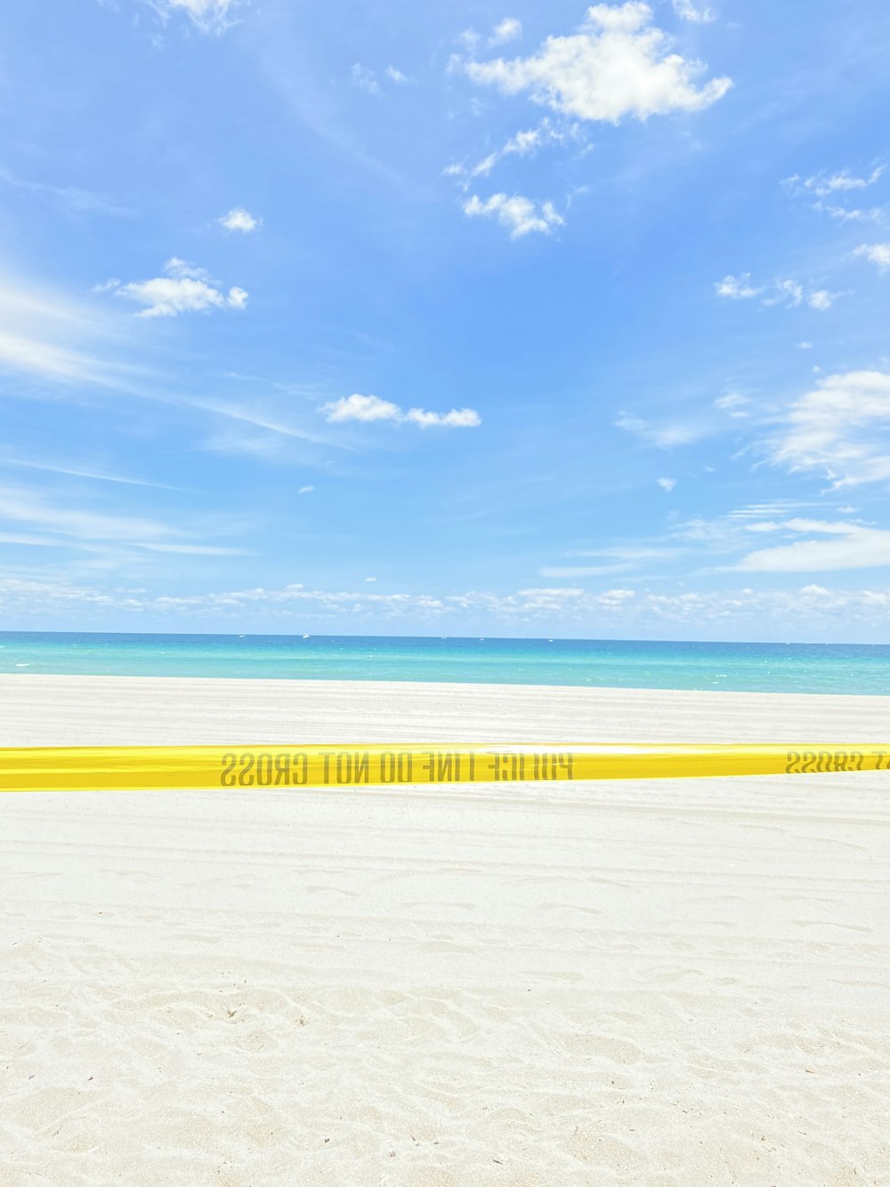 white sand beach under blue sky during daytime