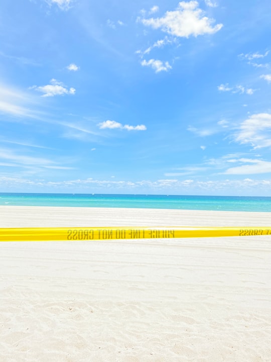 white sand beach under blue sky during daytime in Sunny Isles Beach United States