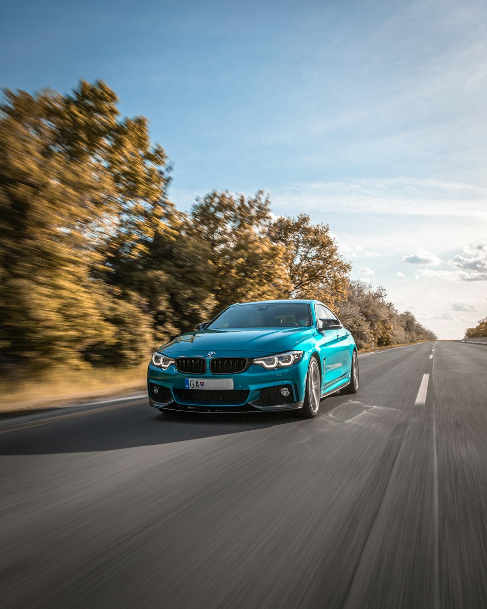 blue audi a 4 on road during daytime