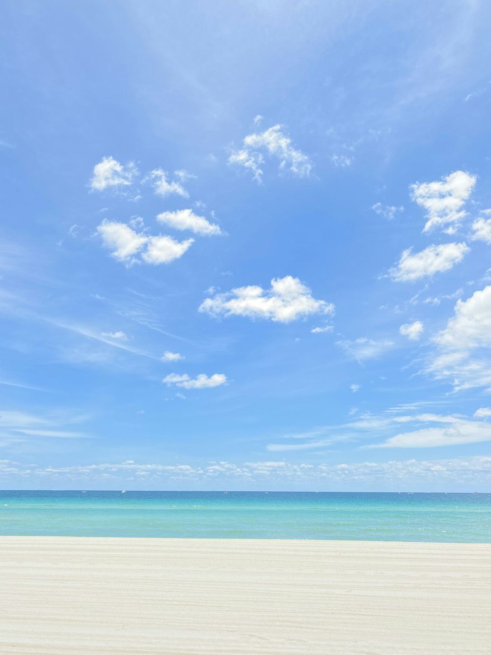 blue sky and white clouds over sea