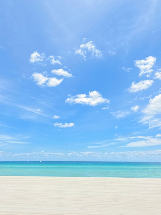 blue sky and white clouds over sea in Sunny Isles Beach United States