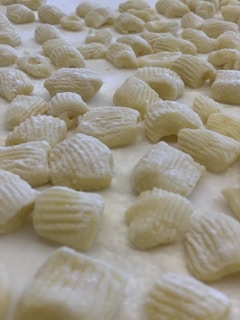 white and yellow food on white ceramic plate