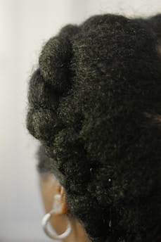 person with black curly hair