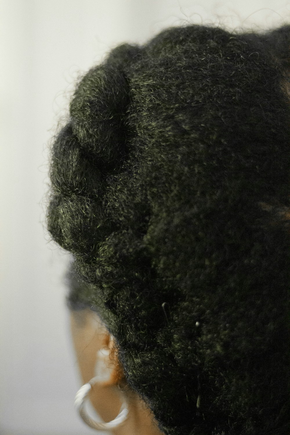 person with black curly hair