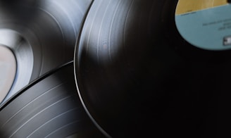 black vinyl record on silver round plate