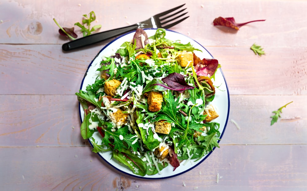 vegetable salad on blue ceramic plate