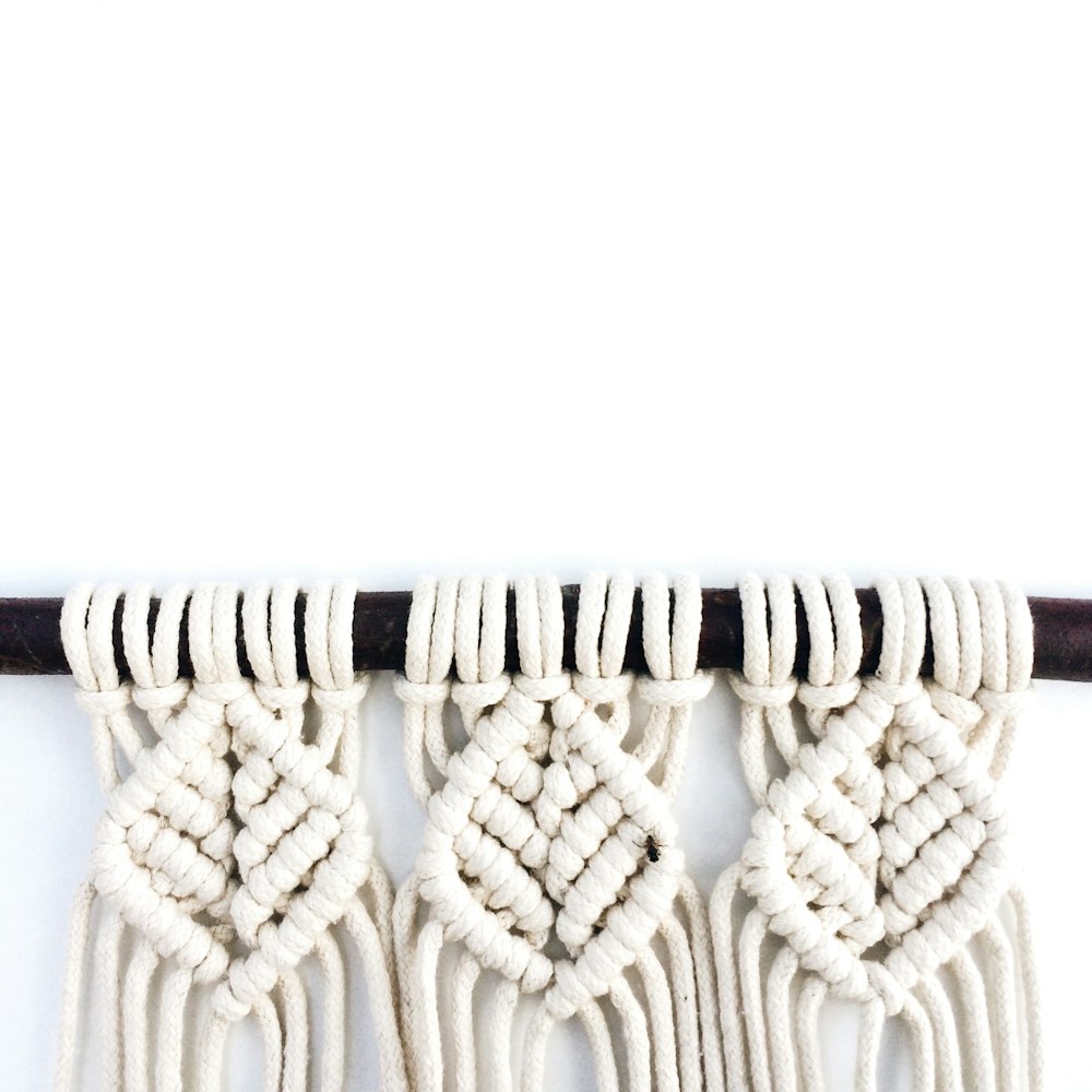 brown and black rope on white background