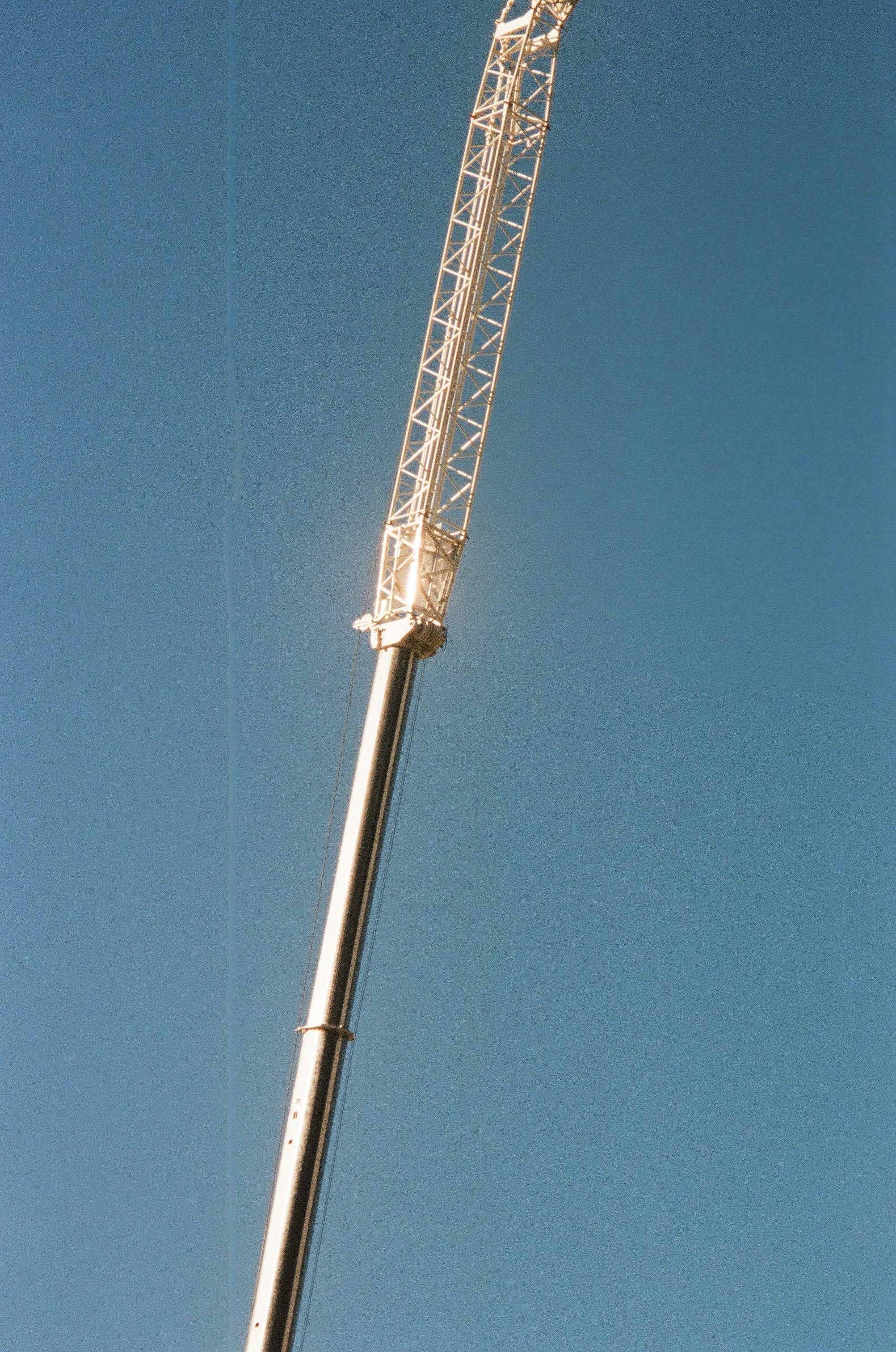 gray metal tower under blue sky