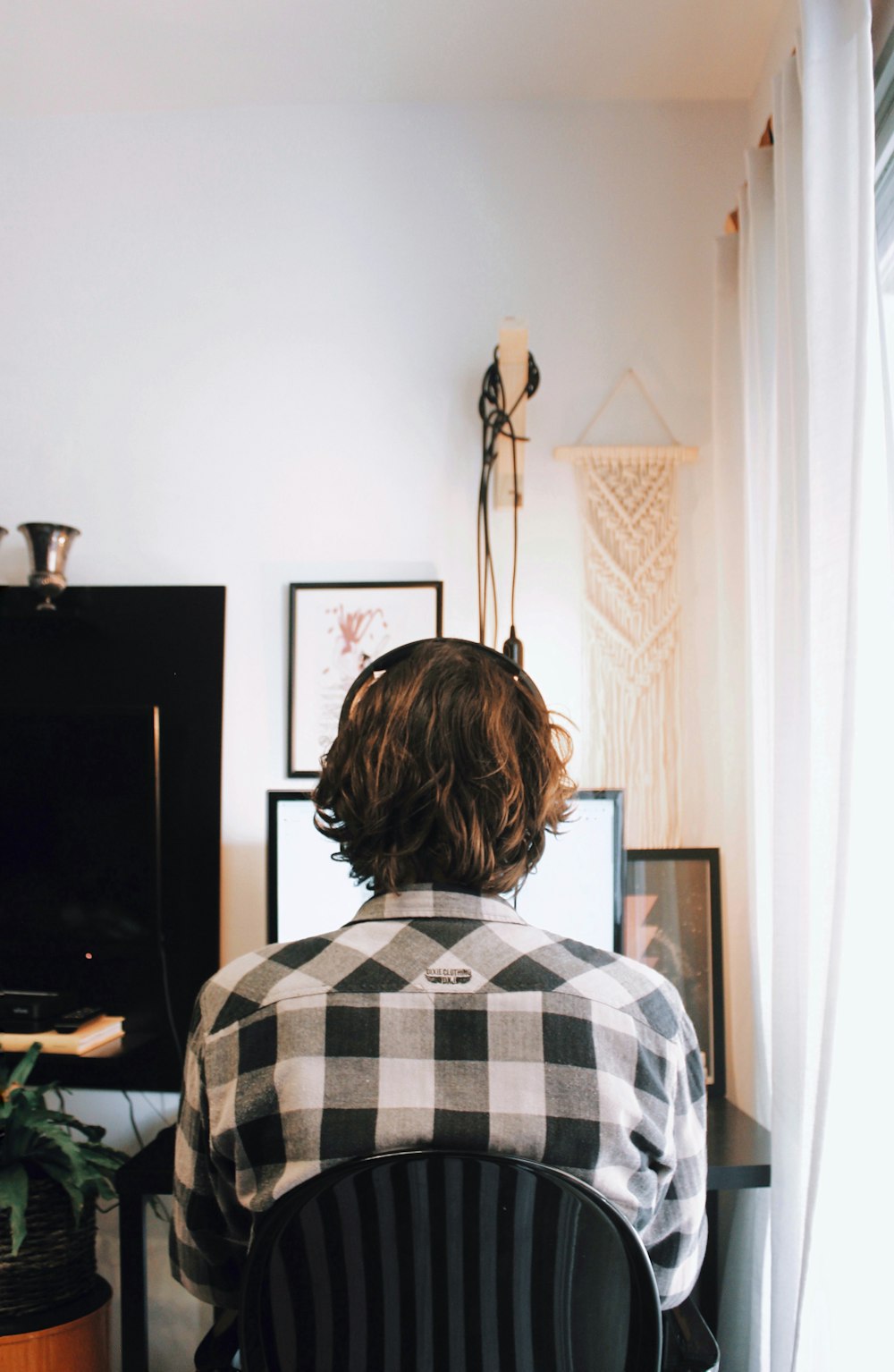 woman in white grey and black plaid shirt