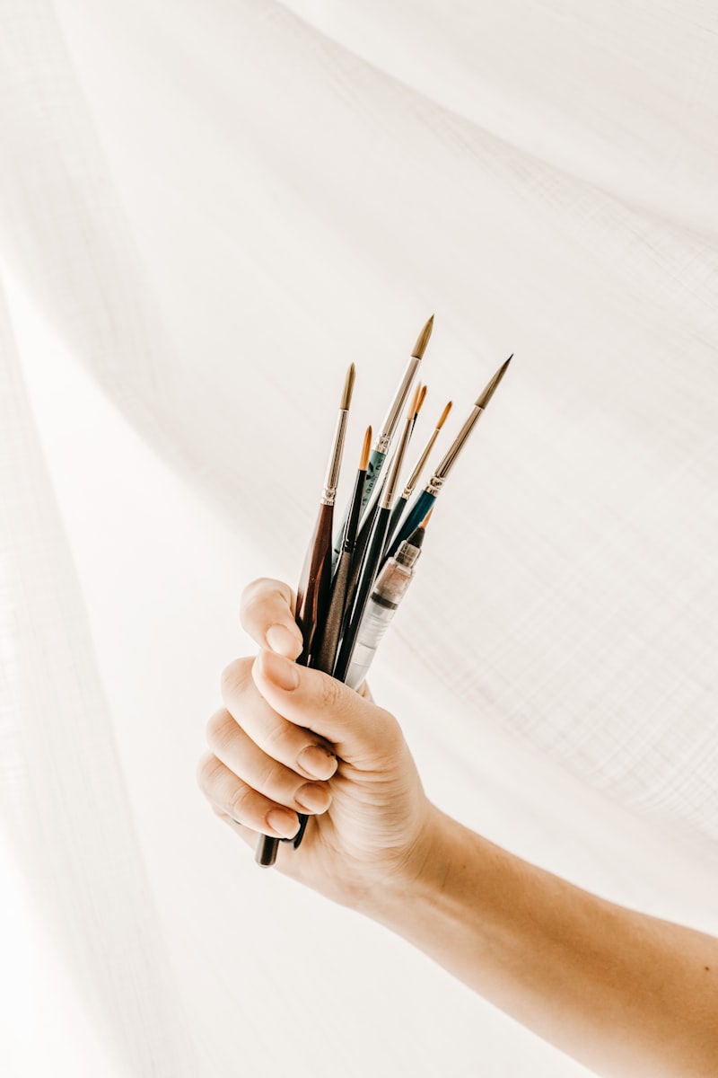 Person holding paint brush
