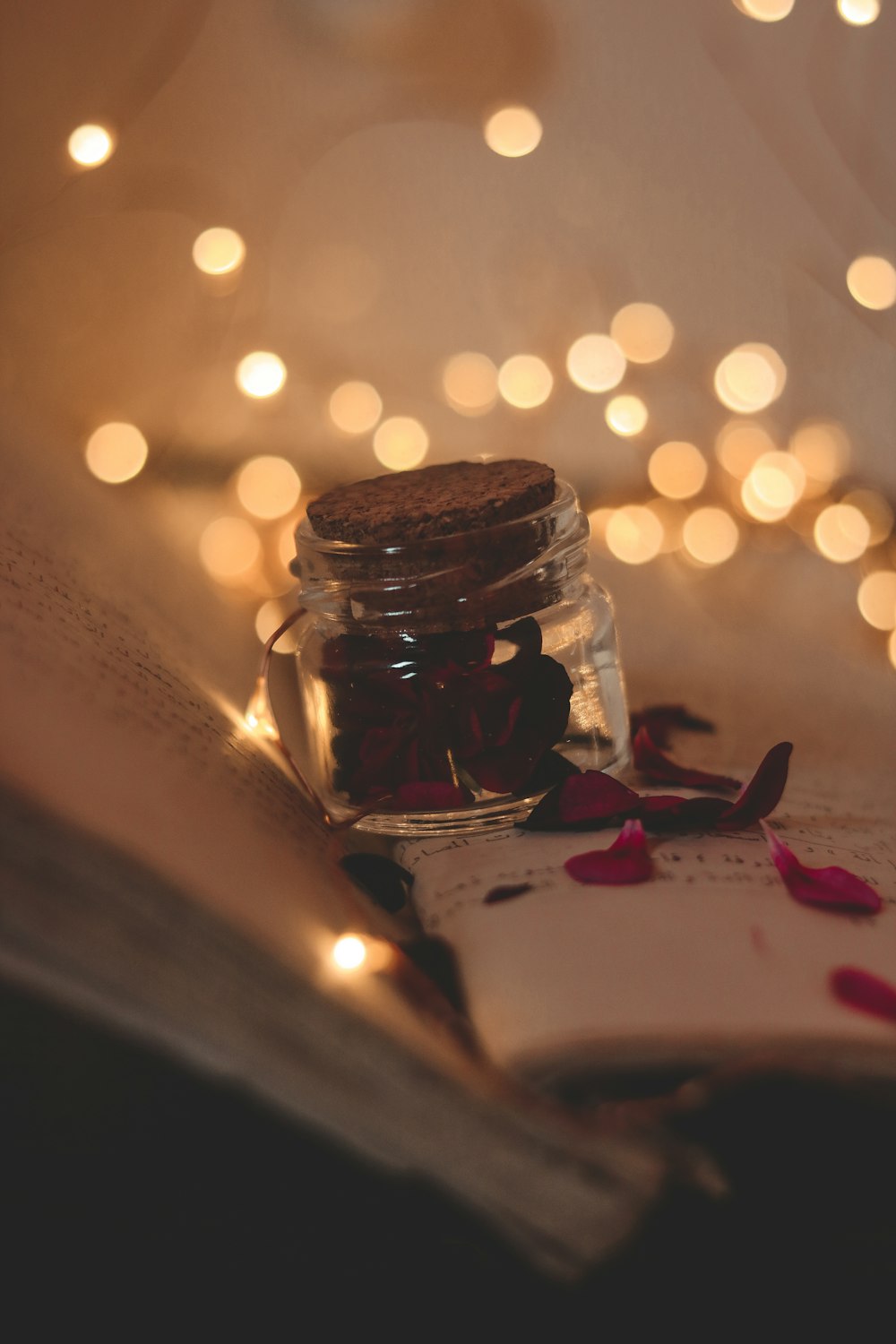 clear glass jar with white string lights