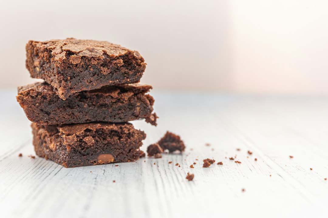 Stack of fresh, gourmet chocolate brownies sprinkled with sea salt