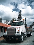 white truck parked near house during daytime