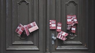 red and white plastic packs on brown wooden door