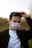 man in black jacket wearing white face mask