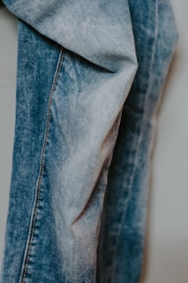 person wearing blue denim jeans