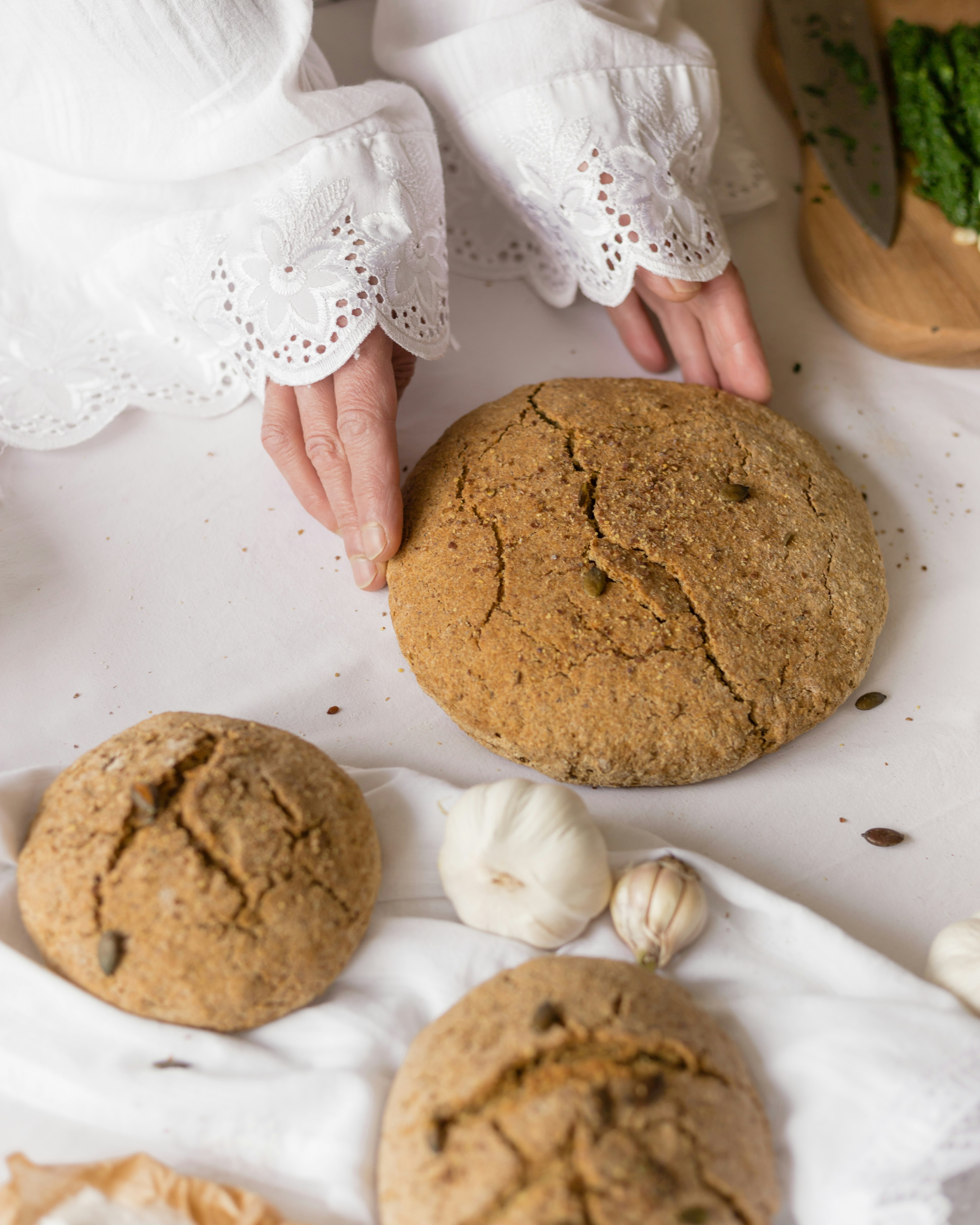 person holding brown round cookie