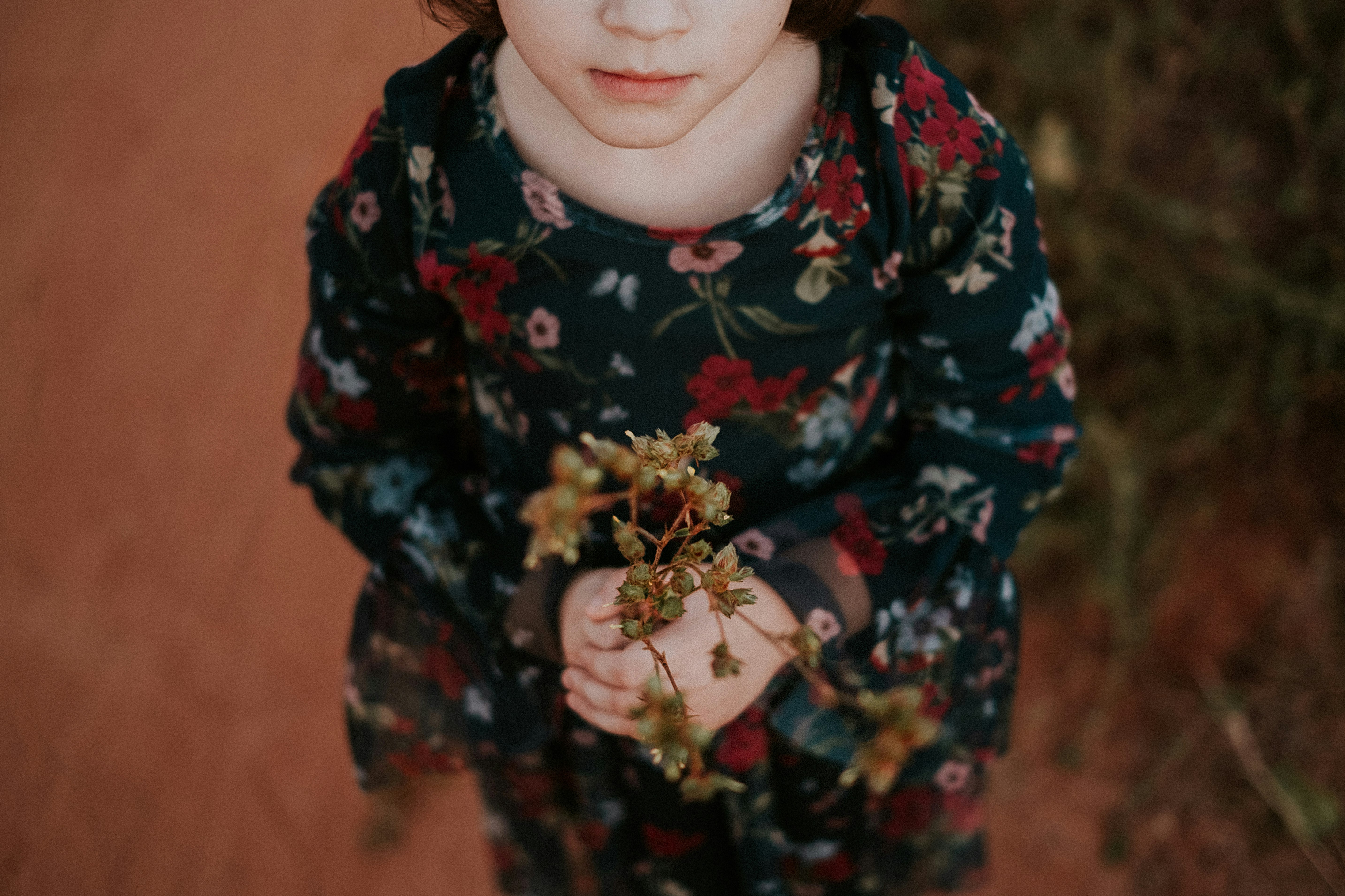 girl in black and red floral long sleeve shirt