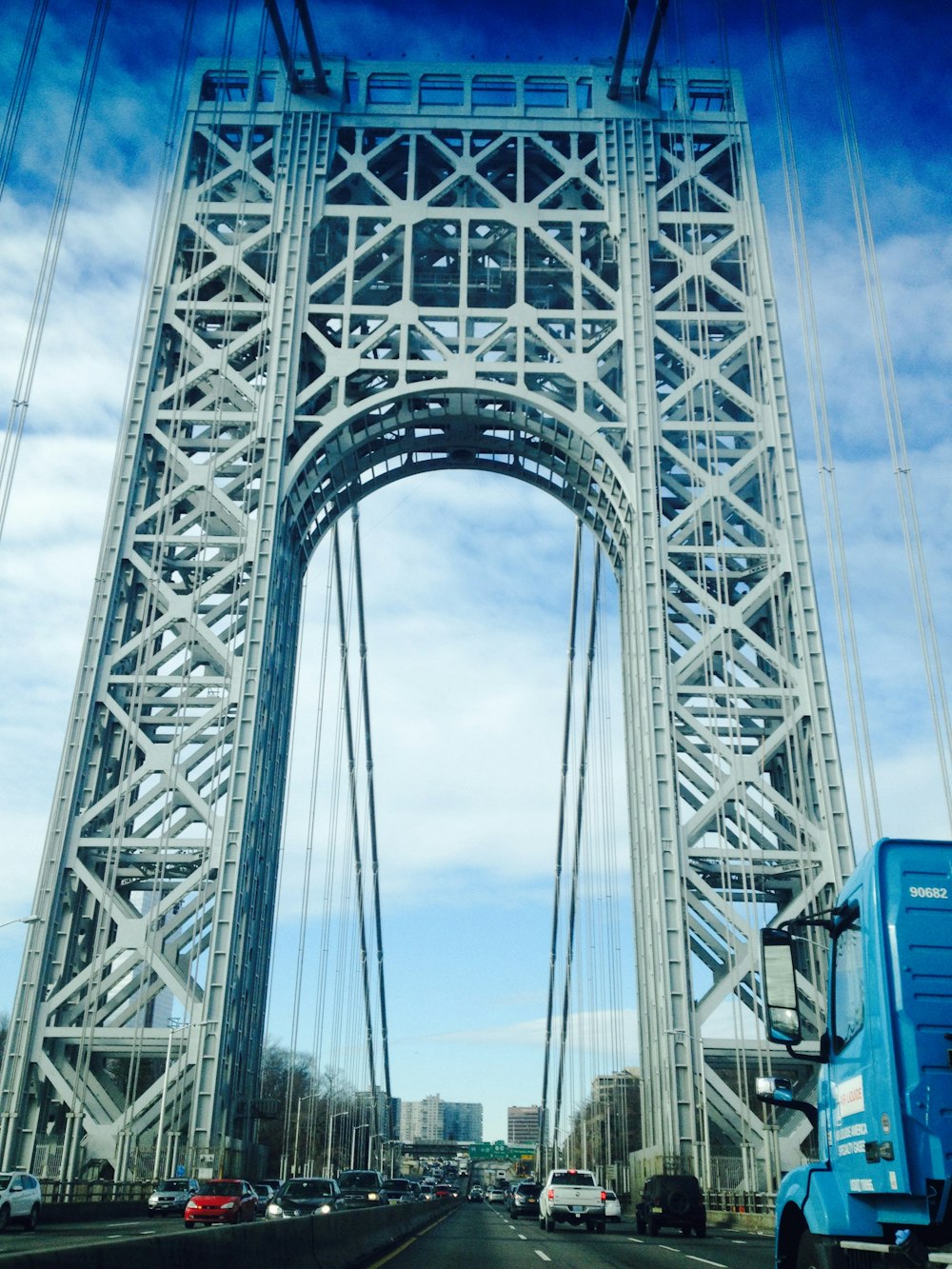 gray metal bridge under blue sky during daytime