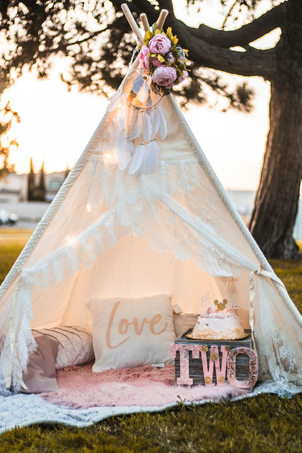 woman in white wedding gown standing beside brown wooden table