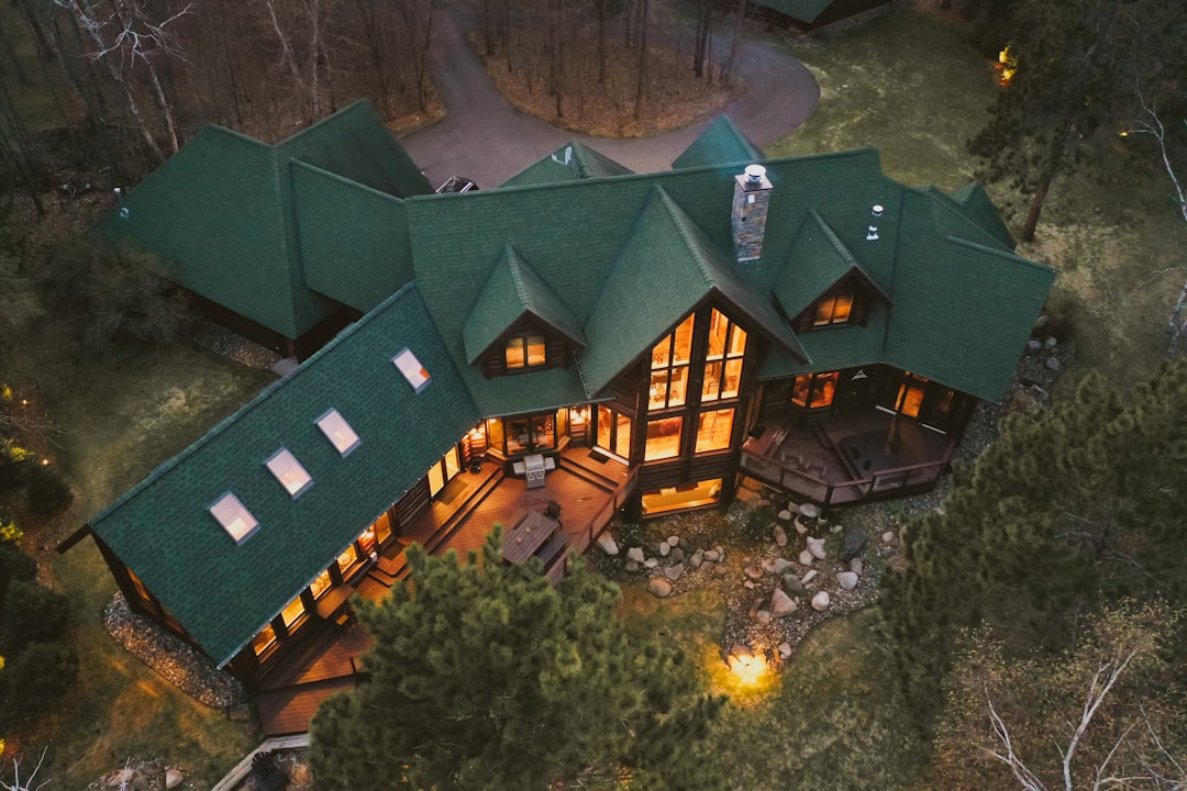 green and brown concrete building, Cabin on the lake