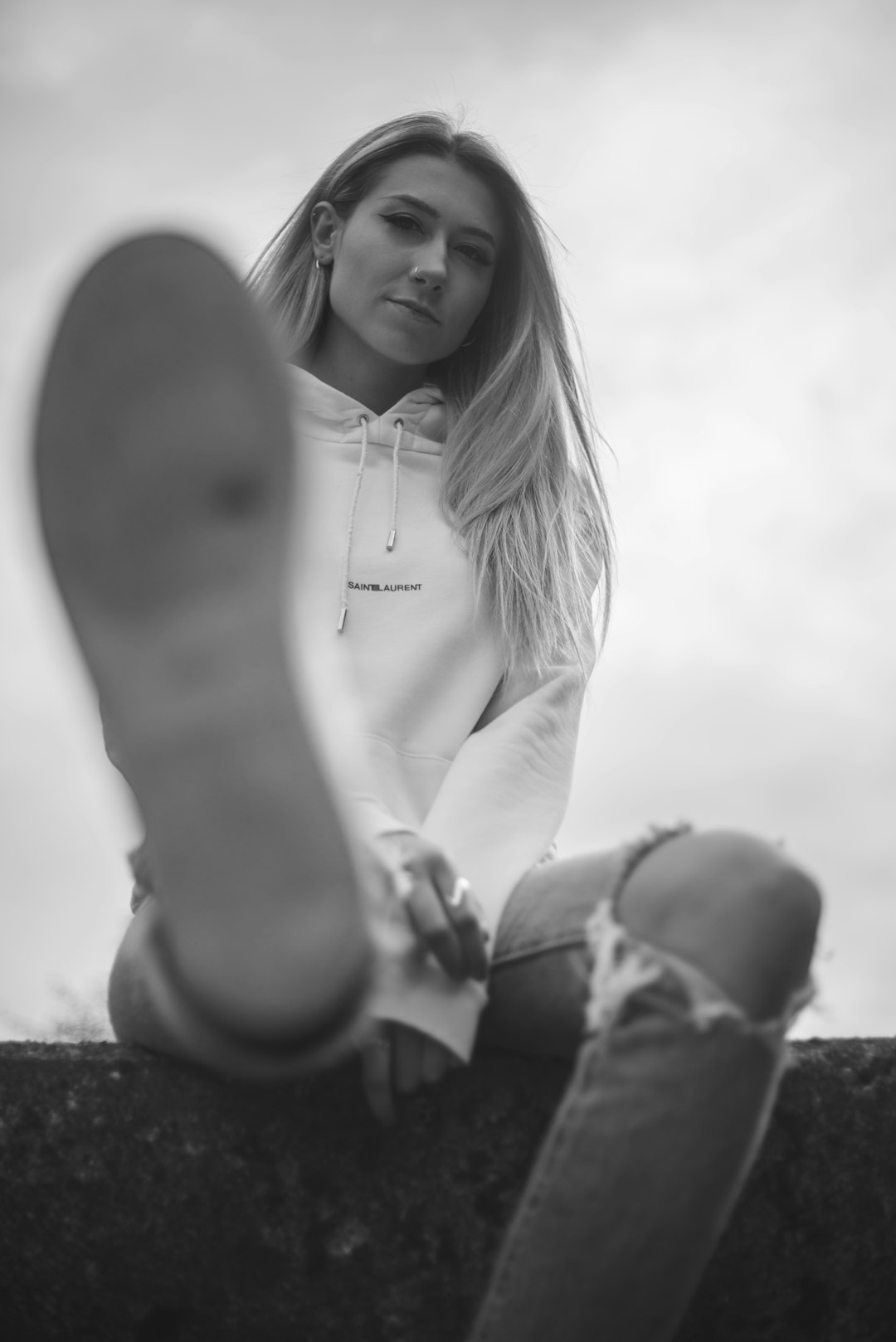 woman in white long sleeve shirt and black pants