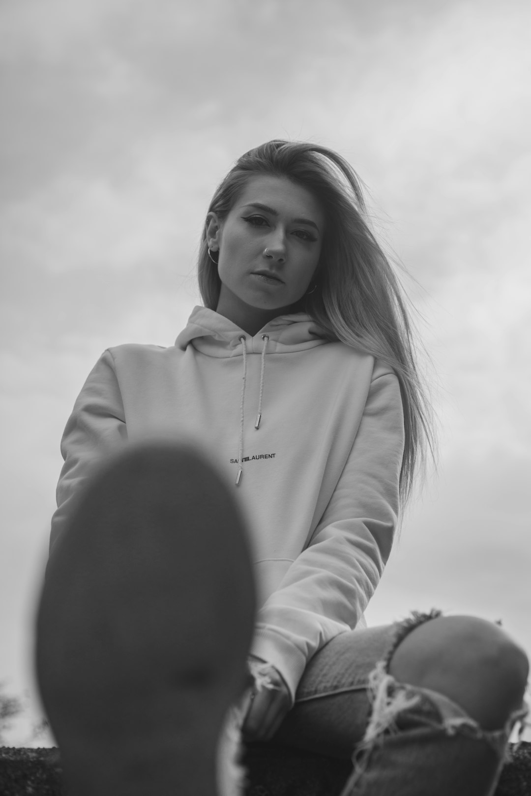 grayscale photo of woman in hoodie