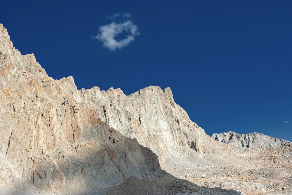 brown rocky mountain under blue sky during daytime