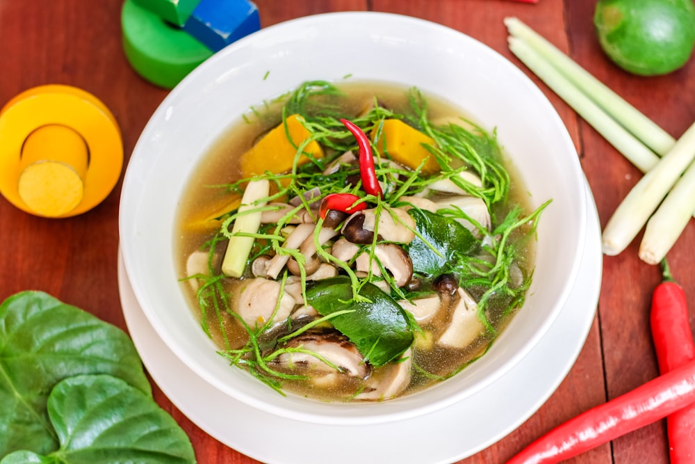 soup with vegetables in white ceramic bowl