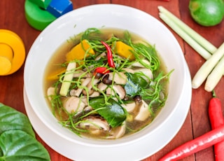 soup with vegetables in white ceramic bowl