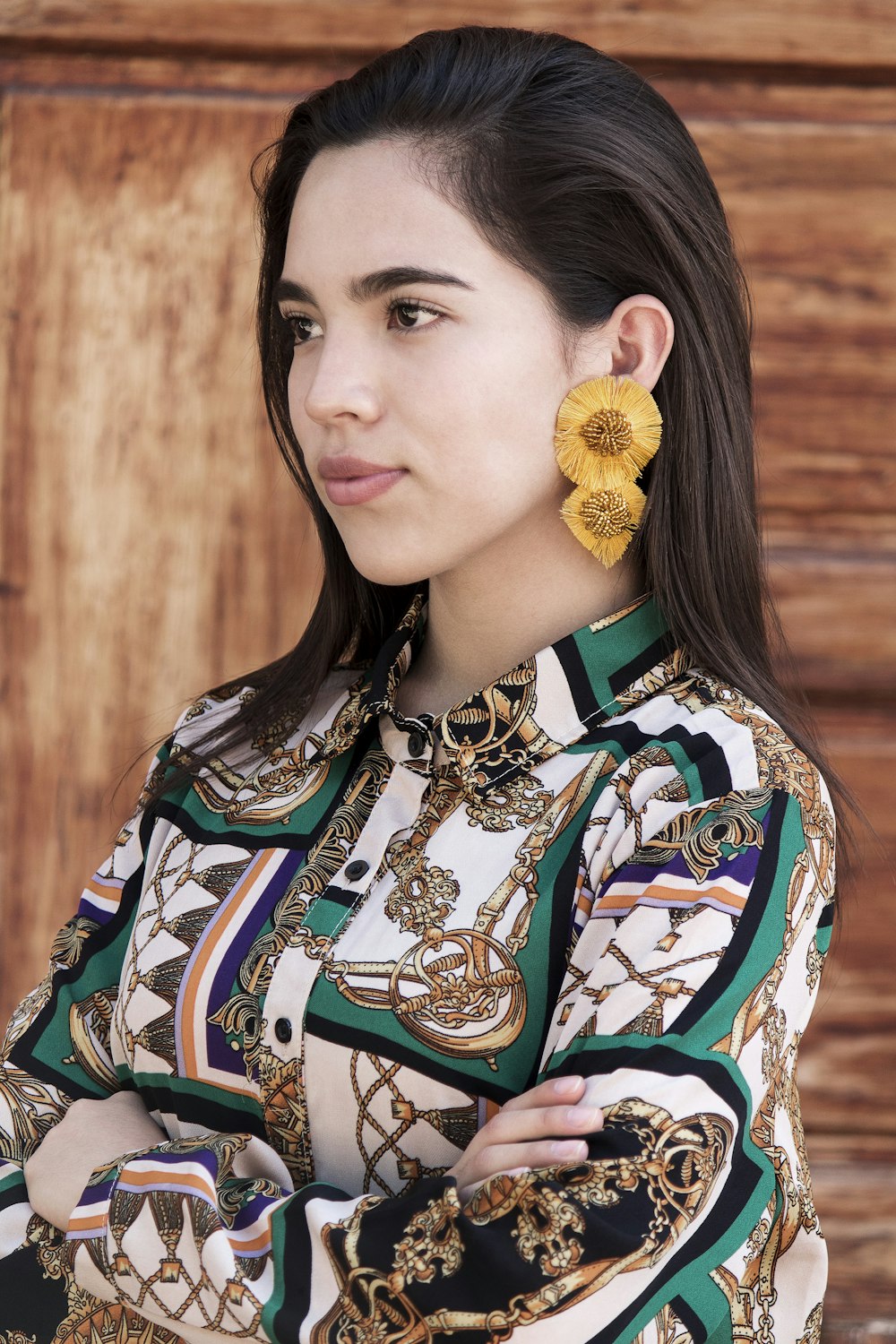 woman in yellow and blue floral shirt