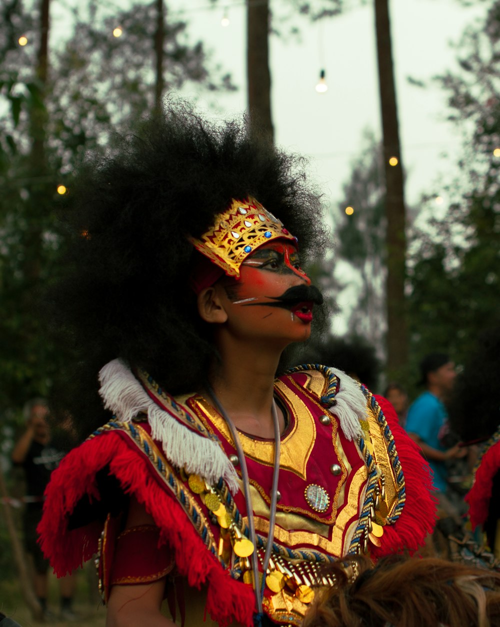 woman in yellow and red dress wearing sunglasses