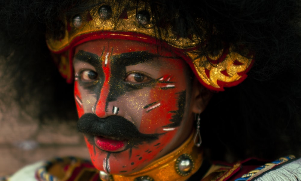 woman with red and black face paint