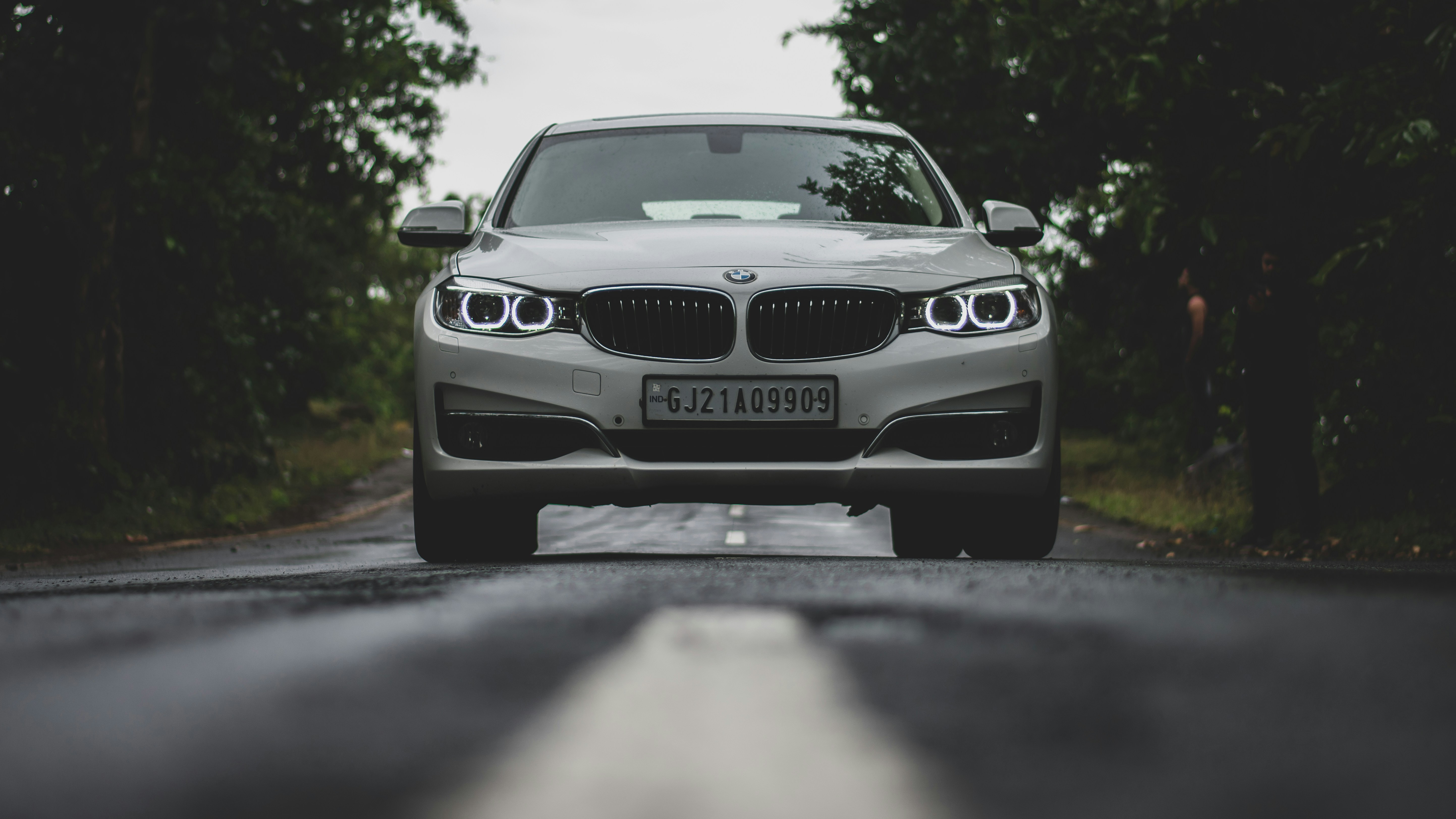 white bmw m 3 on road during daytime