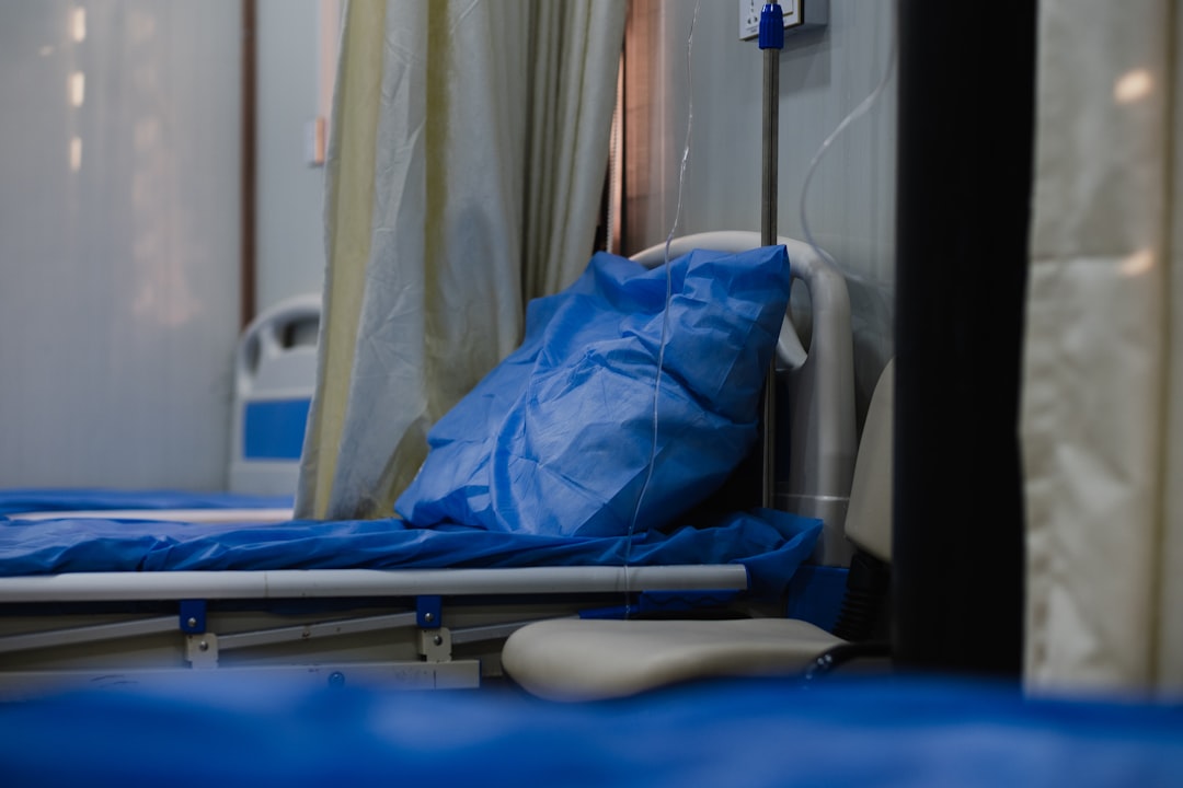 blue textile on blue and white hospital bed