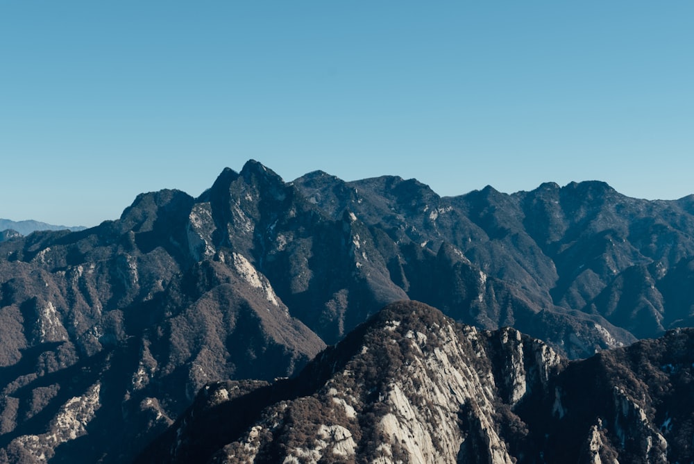 brown rocky mountain under blue sky during daytime