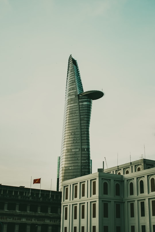 white concrete building during daytime in Bitexco Financial Tower Vietnam