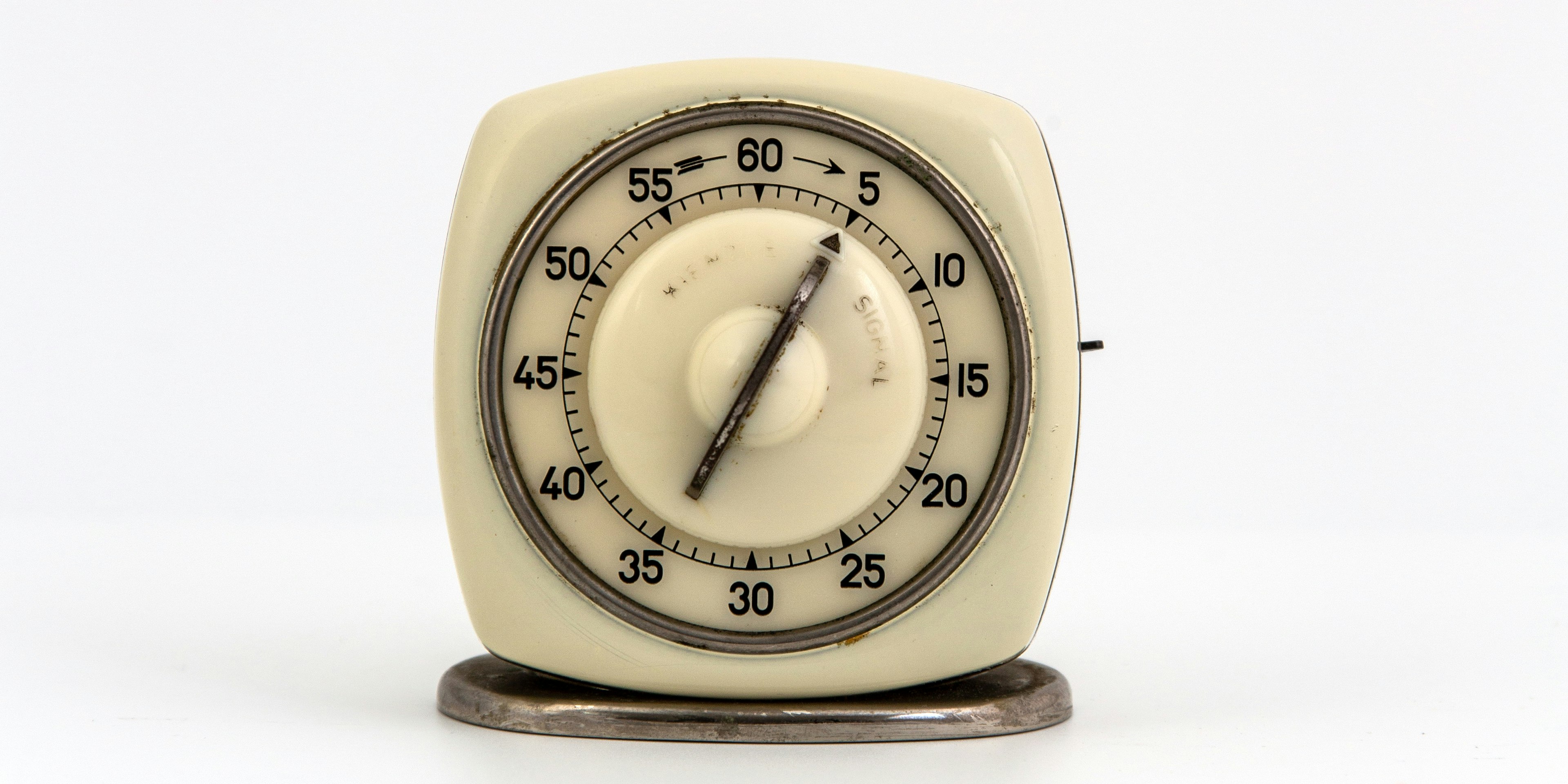 yellow and silver analog desk clock