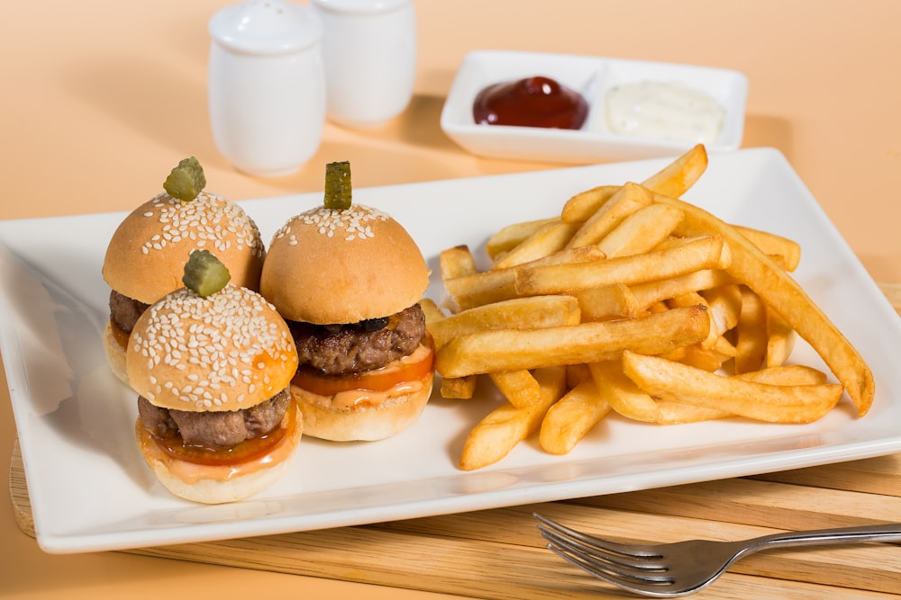 burger and fries on white ceramic plate