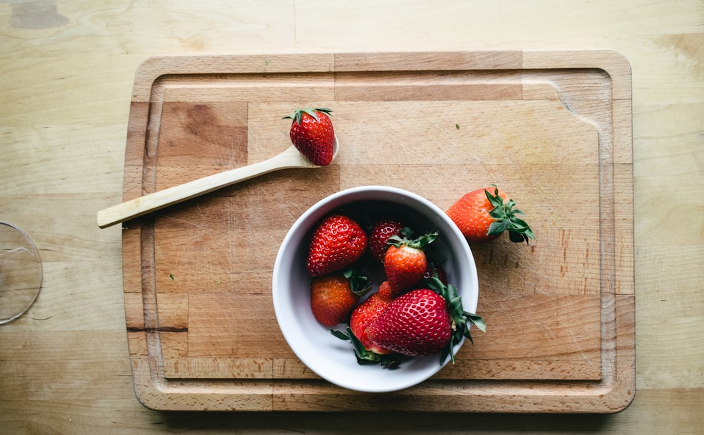 strawberries in white ceramic bowl